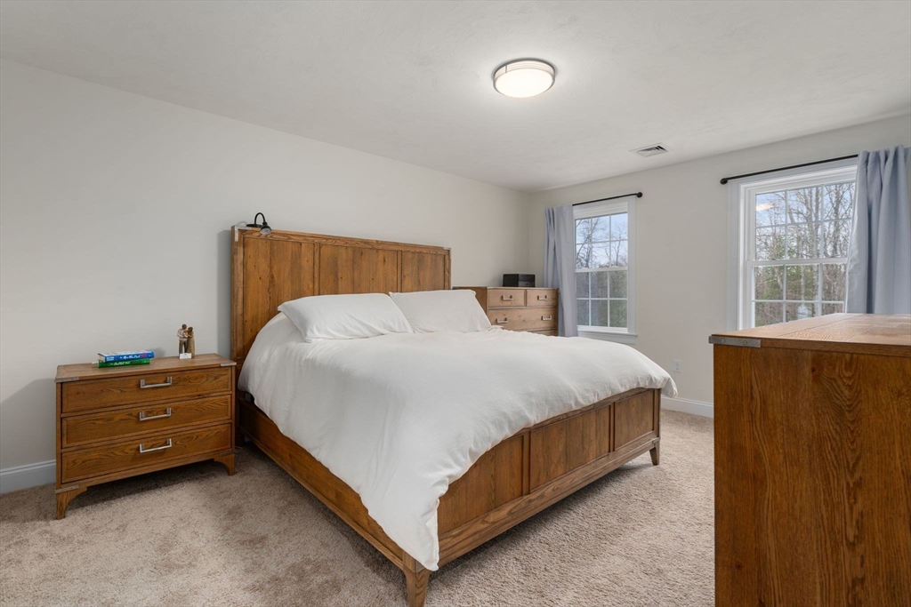 813 Chase Road Lunenburg, MA 01462 - Photo 18 of 41 a bed room with a bed and window
