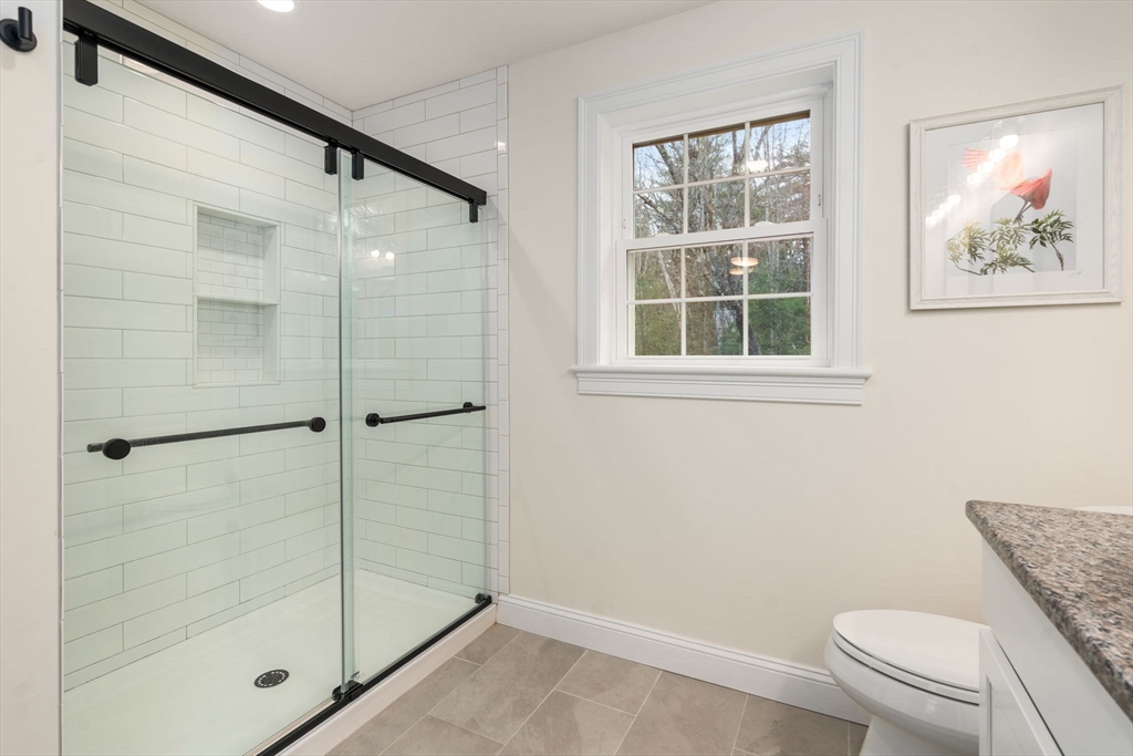 813 Chase Road Lunenburg, MA 01462 - Photo 20 of 41 a bathroom with a shower and a toilet