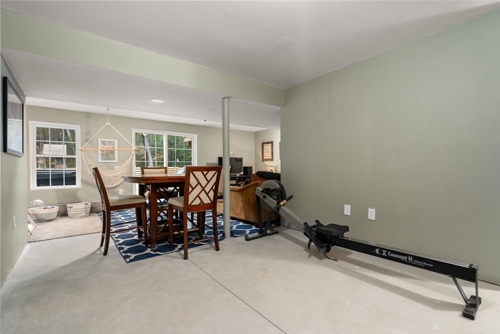 813 Chase Road Lunenburg, MA 01462 - Photo 27 of 41 a room with gym equipment and a window