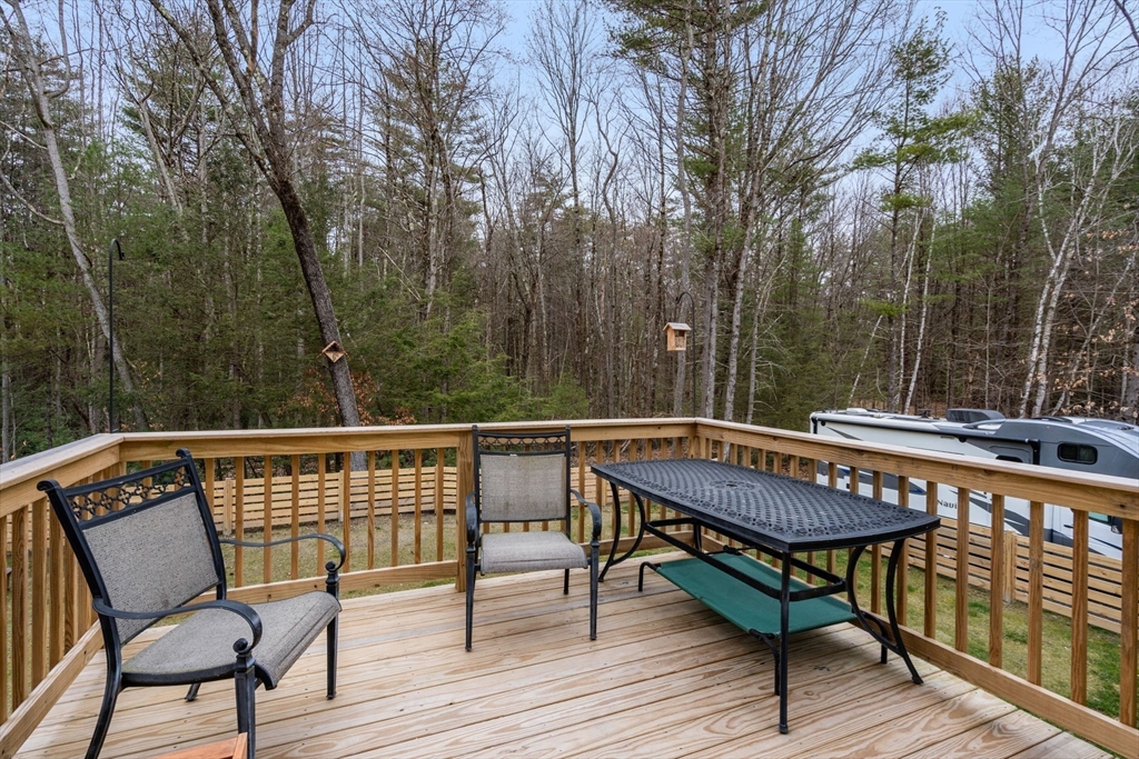 813 Chase Road Lunenburg, MA 01462 - Photo 31 of 41 a view of a chairs and table on the deck