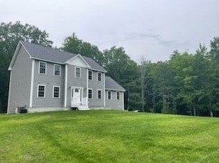 813 Chase Road Lunenburg, MA 01462 - Photo 33 of 41 a front view of a house with a garden