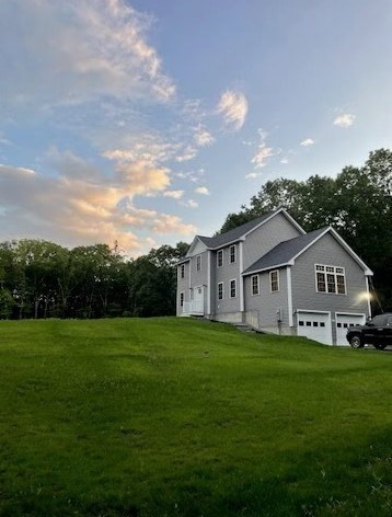 813 Chase Road Lunenburg, MA 01462 - Photo 35 of 41 a view of a house with a big yard and large trees