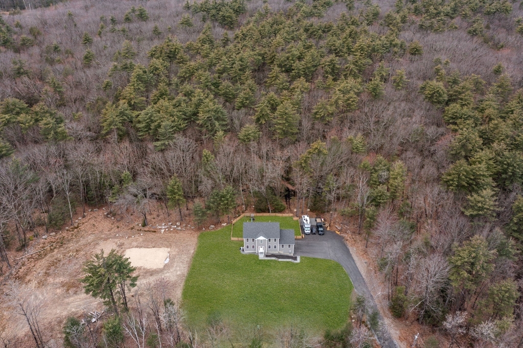 813 Chase Road Lunenburg, MA 01462 - Photo 39 of 41 a view of a yard with large trees