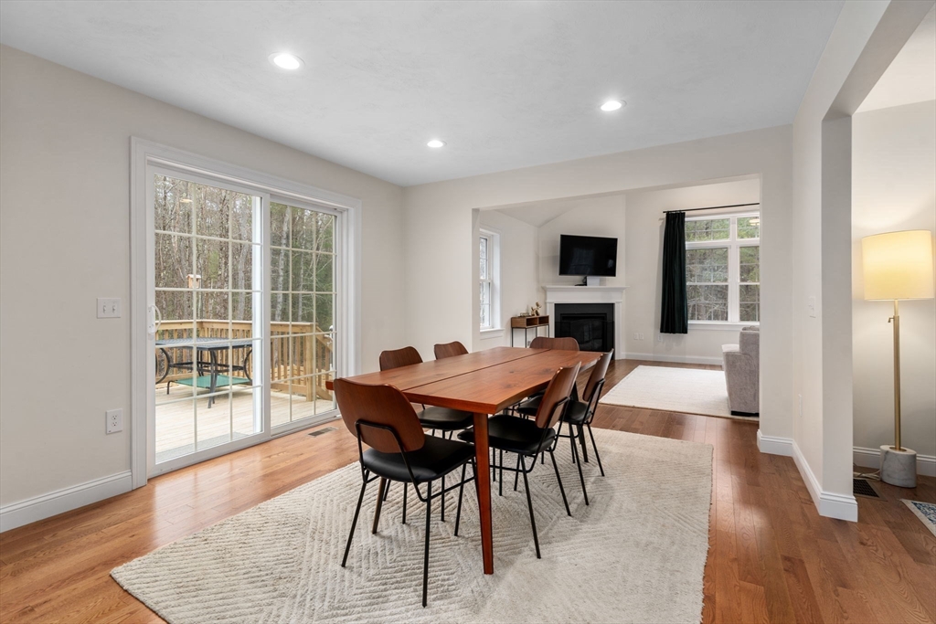 813 Chase Road Lunenburg, MA 01462 - Photo 8 of 41 a view of a dining room with furniture window and wooden floor
