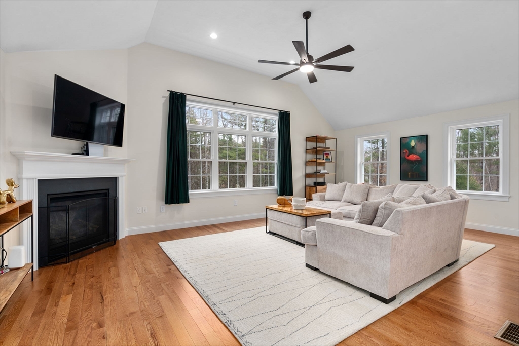 813 Chase Road Lunenburg, MA 01462 - Photo 9 of 41 a living room with furniture fireplace and flat screen tv