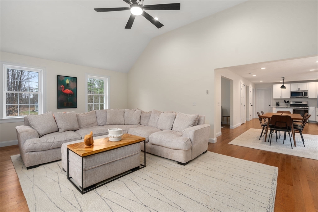 813 Chase Road Lunenburg, MA 01462 - Photo 10 of 41 a living room with furniture and a table