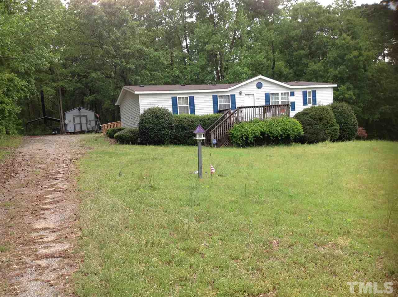2092 Johnston County Road Benson, NC 27504 - Photo 4 of 5 a house view with a garden space