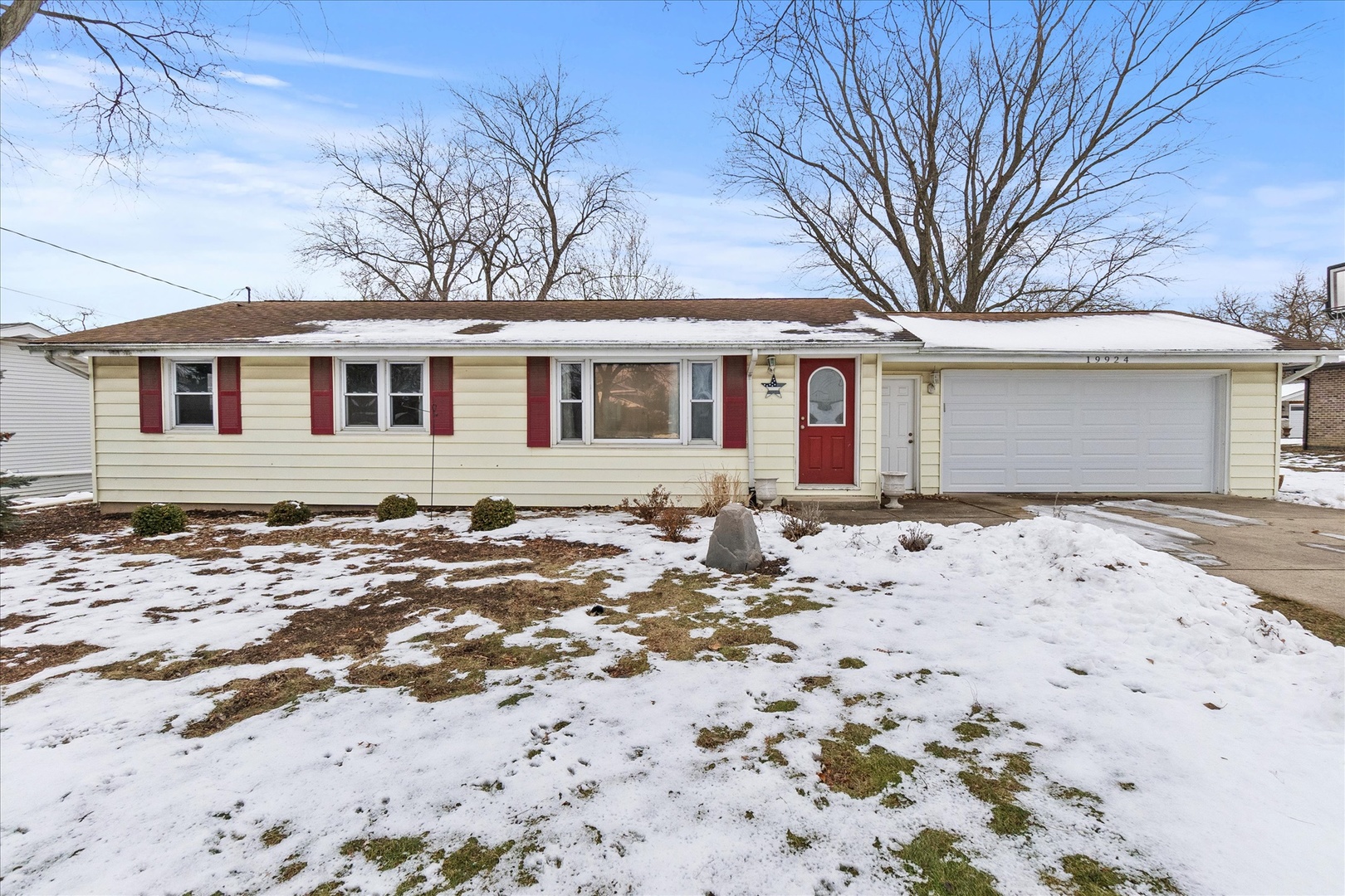 front view of a house with a yard