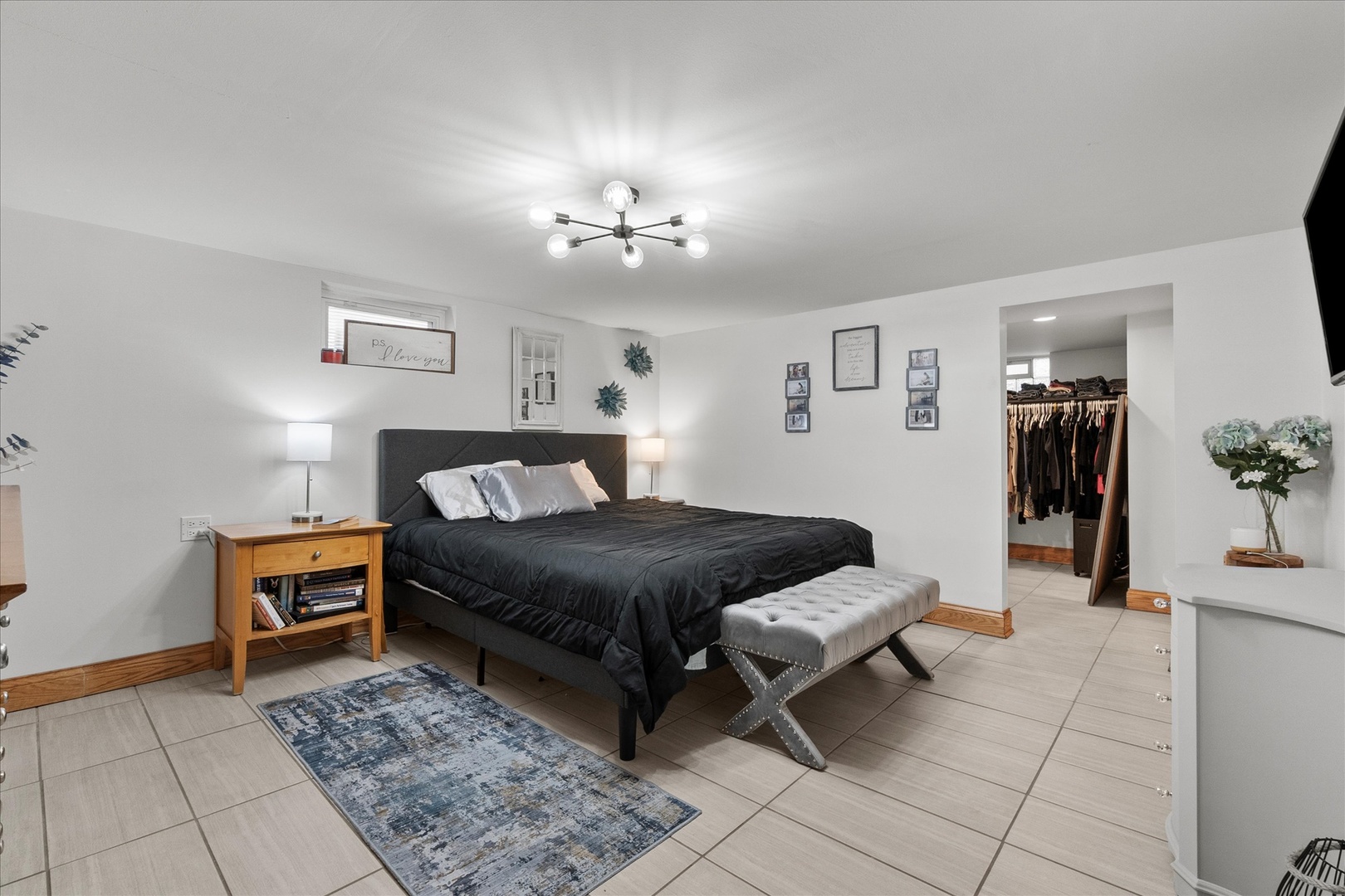 19924 Hillgate Road Mokena, IL 60448 - Photo 16 of 30 a spacious bedroom with a bed and a chandelier