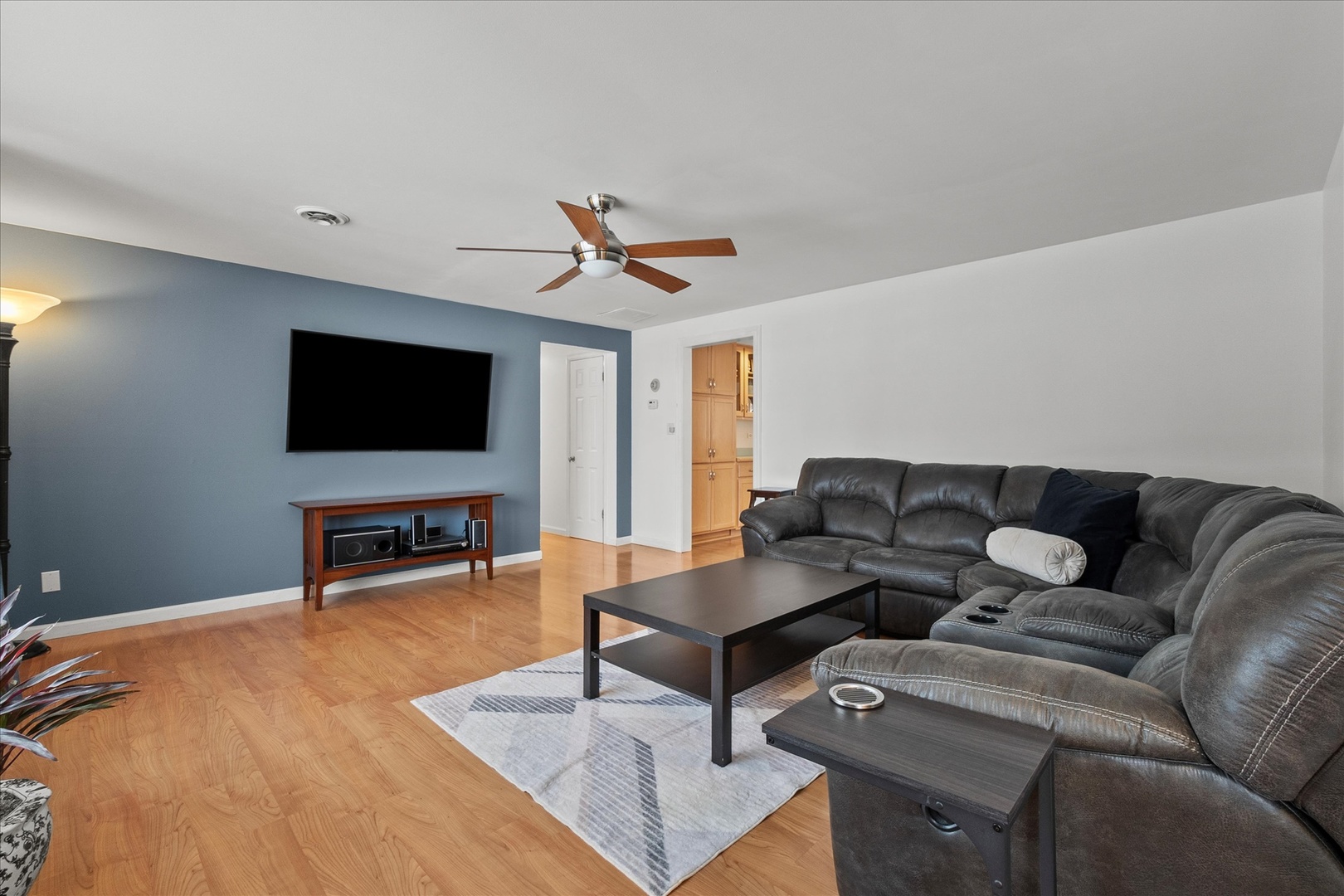 19924 Hillgate Road Mokena, IL 60448 - Photo 5 of 30 a living room with furniture and a flat screen tv