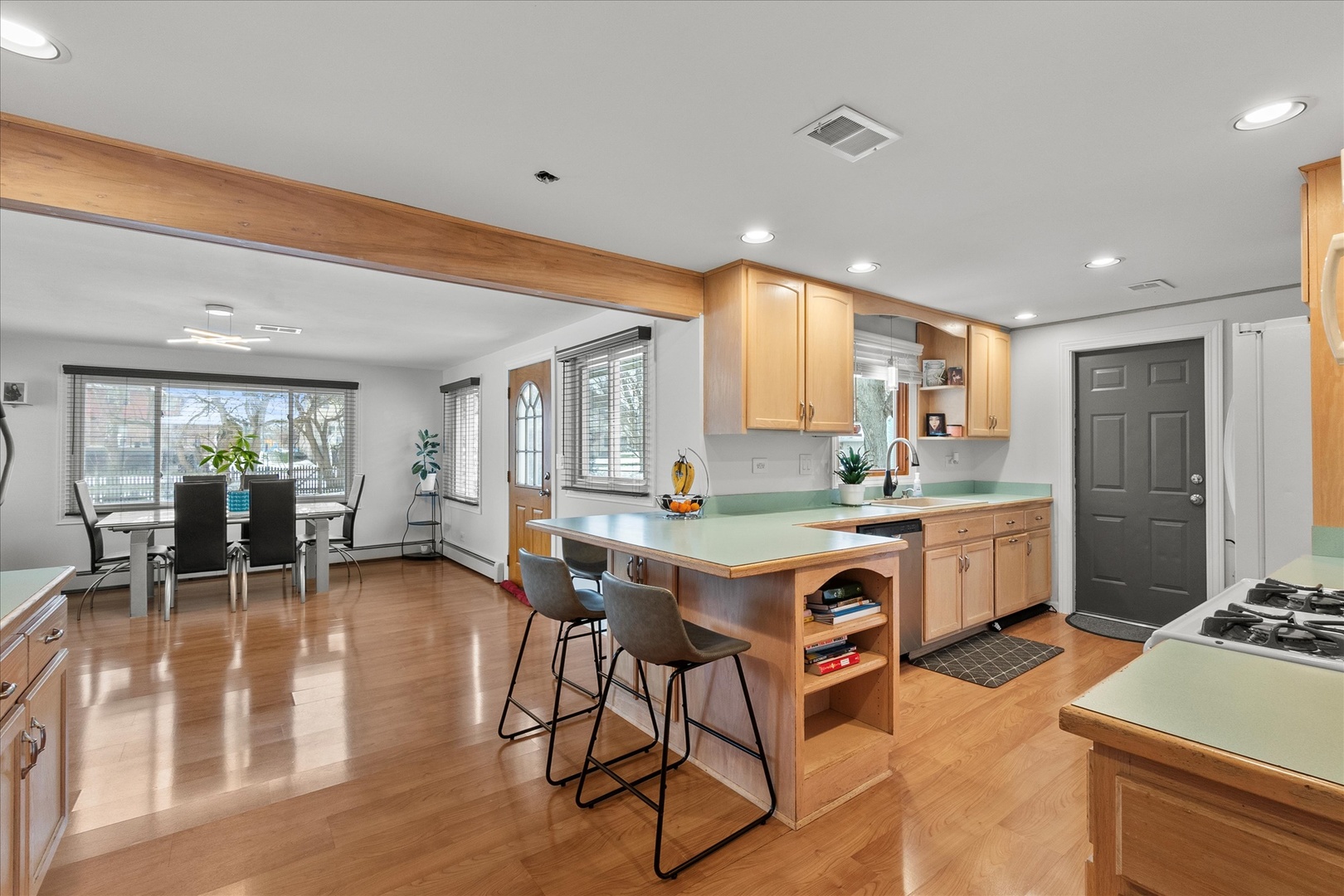 19924 Hillgate Road Mokena, IL 60448 - Photo 9 of 30 a view of kitchen with sink stove dining table and chairs