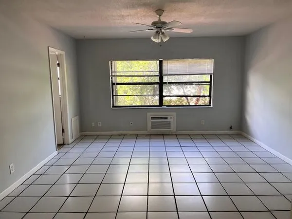 a view of an empty room and window