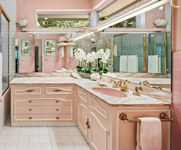 a bathroom with a sink and mirror