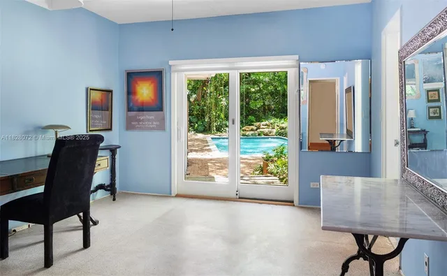 a view of a livingroom with furniture and a window