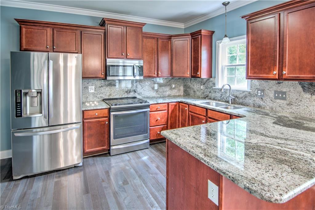 253 Ridge Drive Lexington, NC 27295 - Photo 11 of 27 Stainless appliances and granite counter tops.