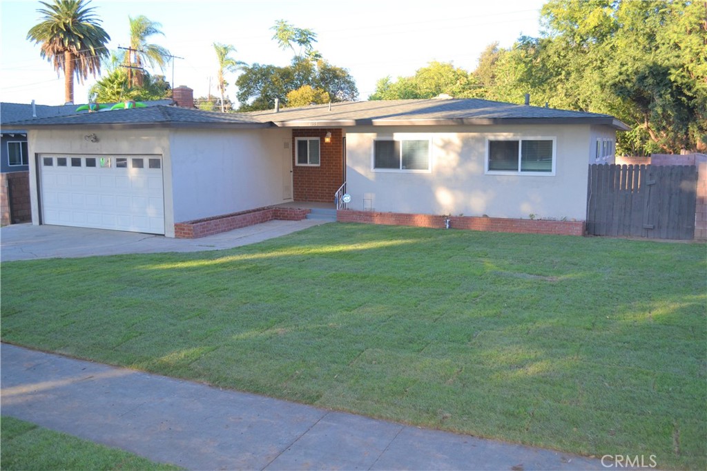 4155 Paden Street Riverside, CA 92504 - Photo 1 of 1 a front view of house with yard and trees