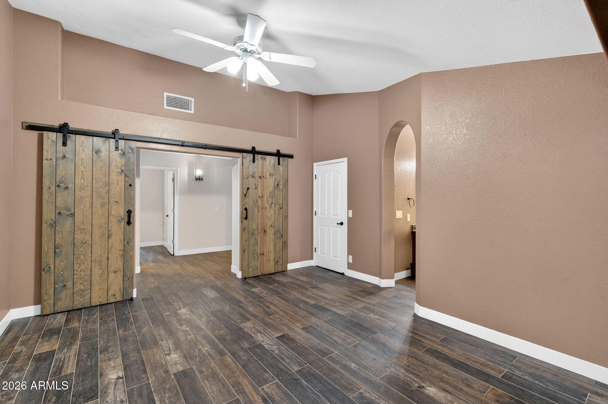 3242 North Ricardo Circle Mesa, AZ 85215 - Photo 28 of 79 a view of an empty room with wooden floor