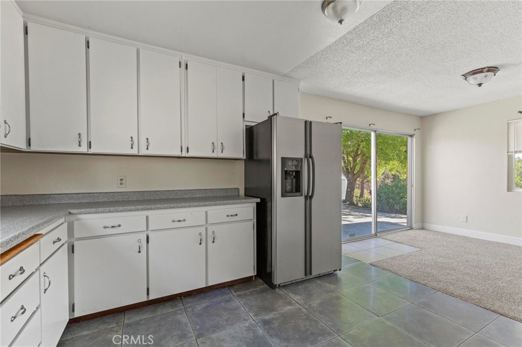 3305 Grubbs Road Oroville, CA 95966 - Photo 11 of 43 a kitchen with cabinets appliances and a window