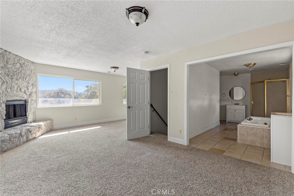 3305 Grubbs Road Oroville, CA 95966 - Photo 15 of 43 a view of a livingroom with furniture and a fireplace