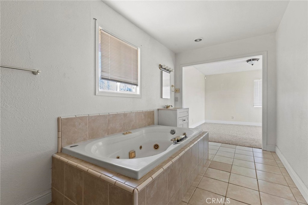 3305 Grubbs Road Oroville, CA 95966 - Photo 19 of 43 a white bath tub sitting in a bathroom
