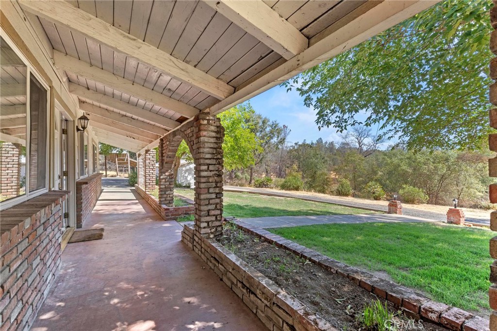 3305 Grubbs Road Oroville, CA 95966 - Photo 4 of 43 a view of a porch with a big yard