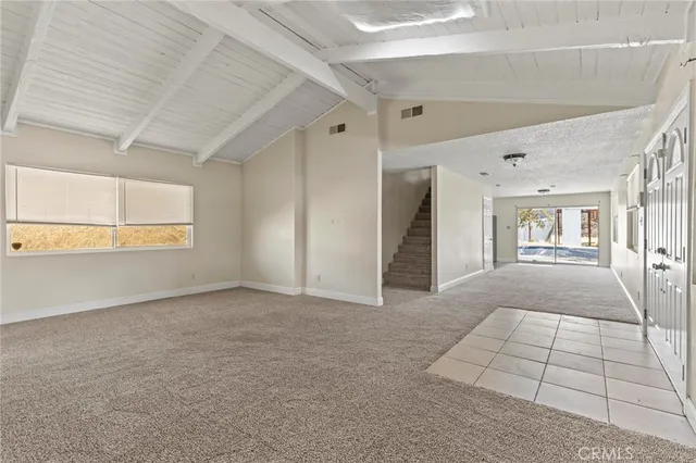 a view of kitchen with stainless steel appliances refrigerator oven and cabinets
