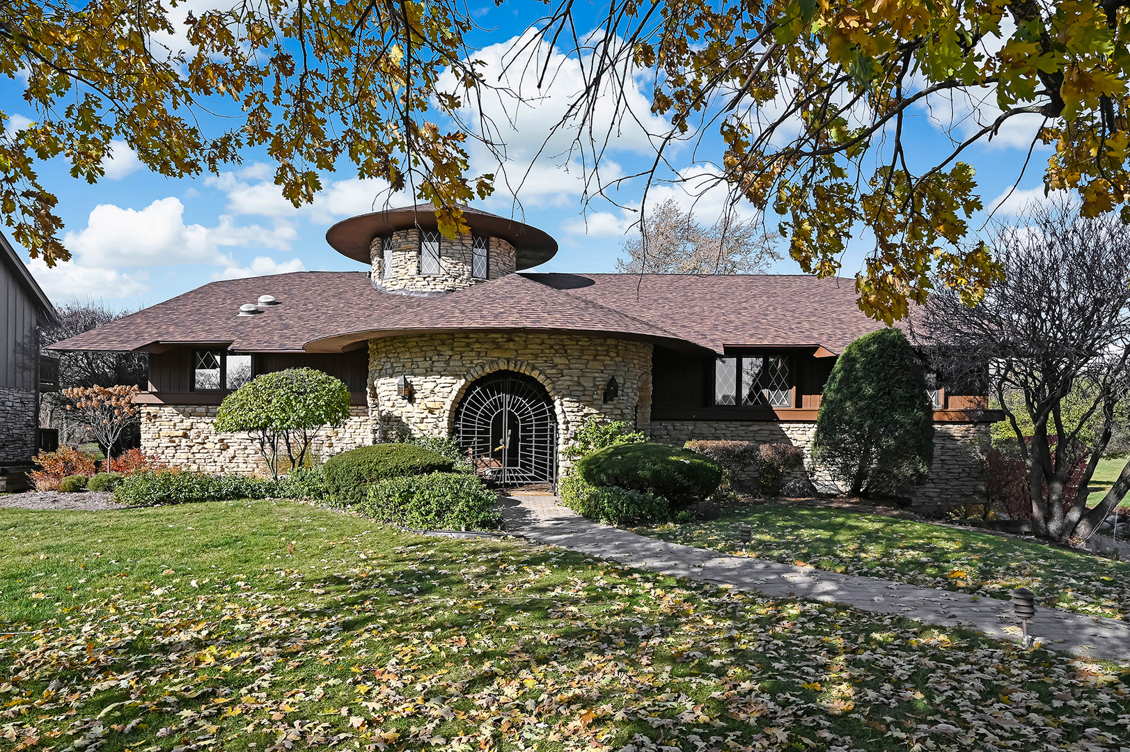a front view of a house with garden