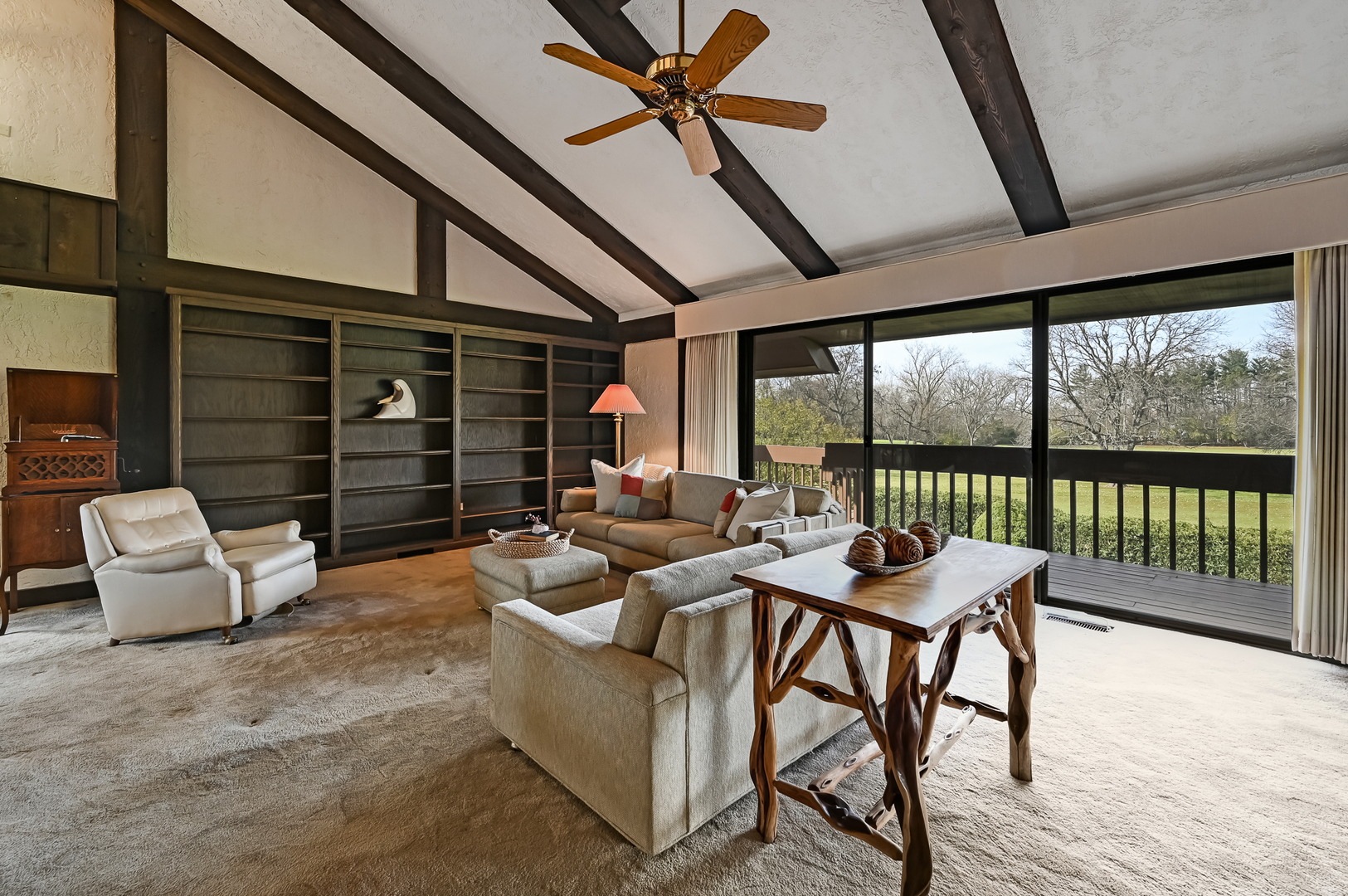 8402 Carriage Green Drive Darien, IL 60561 - Photo 12 of 39 a living room with furniture and a floor to ceiling window