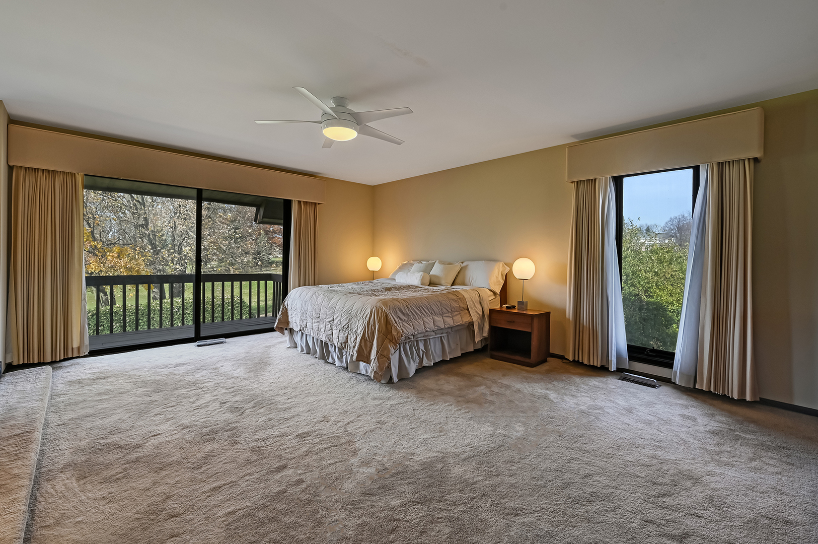 8402 Carriage Green Drive Darien, IL 60561 - Photo 17 of 39 a bed sitting in a spacious bedroom next to a window