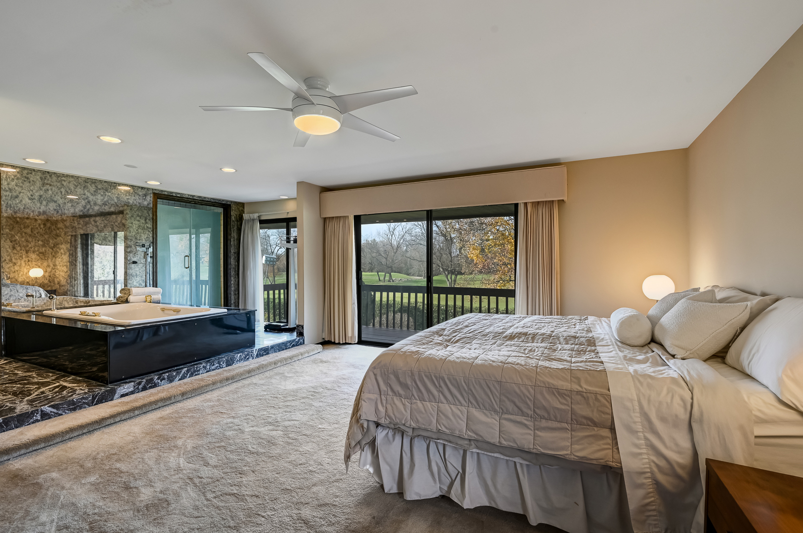 8402 Carriage Green Drive Darien, IL 60561 - Photo 18 of 39 a bedroom with a bed and a large window