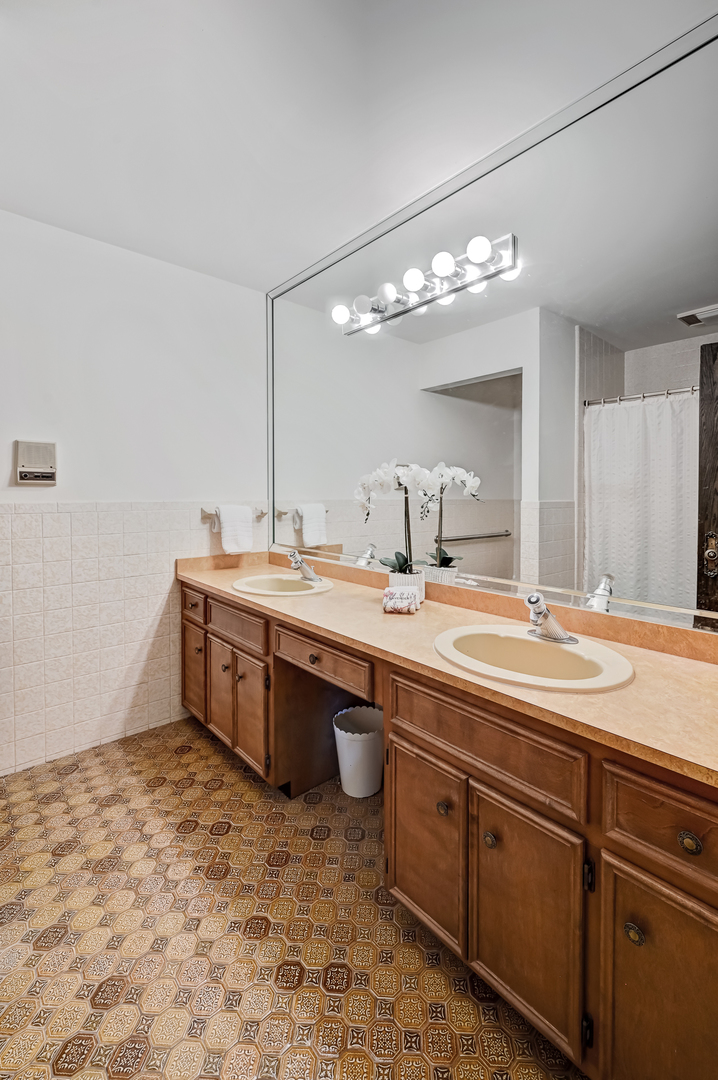 8402 Carriage Green Drive Darien, IL 60561 - Photo 23 of 39 a bathroom with a sink and a mirror