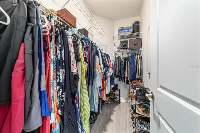 a living room with furniture a couch and a floor to ceiling window