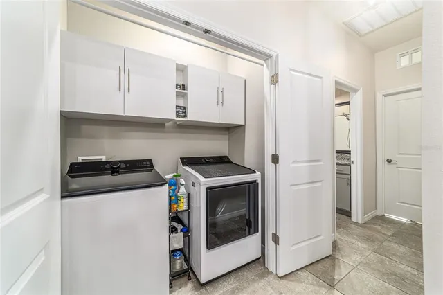 a living room with furniture a window and a table