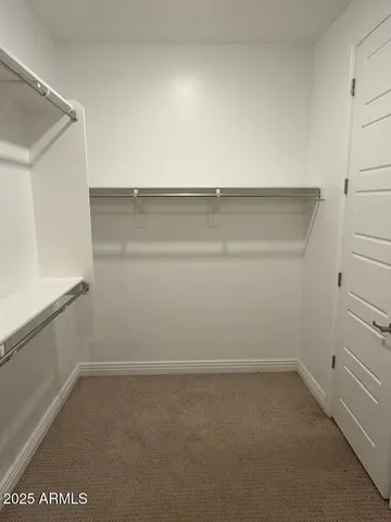 a bathroom with double sink and a mirror