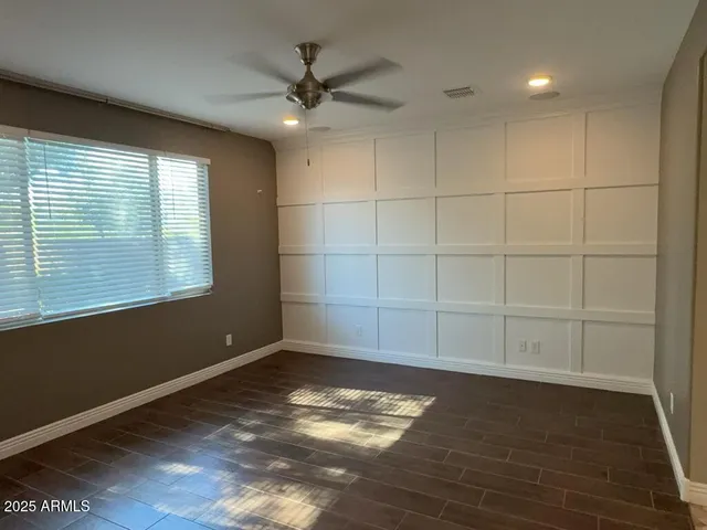 a large kitchen with kitchen island a sink stainless steel appliances and cabinets