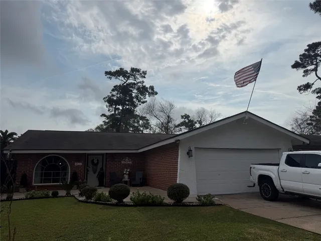 a house view with a garden space