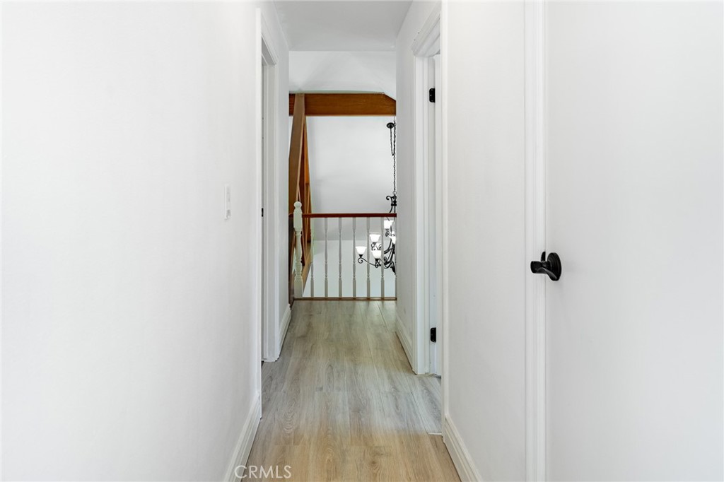 15601 Saddleback Road Canyon Country, CA 91387 - Photo 32 of 55 a view of a hallway with wooden floor