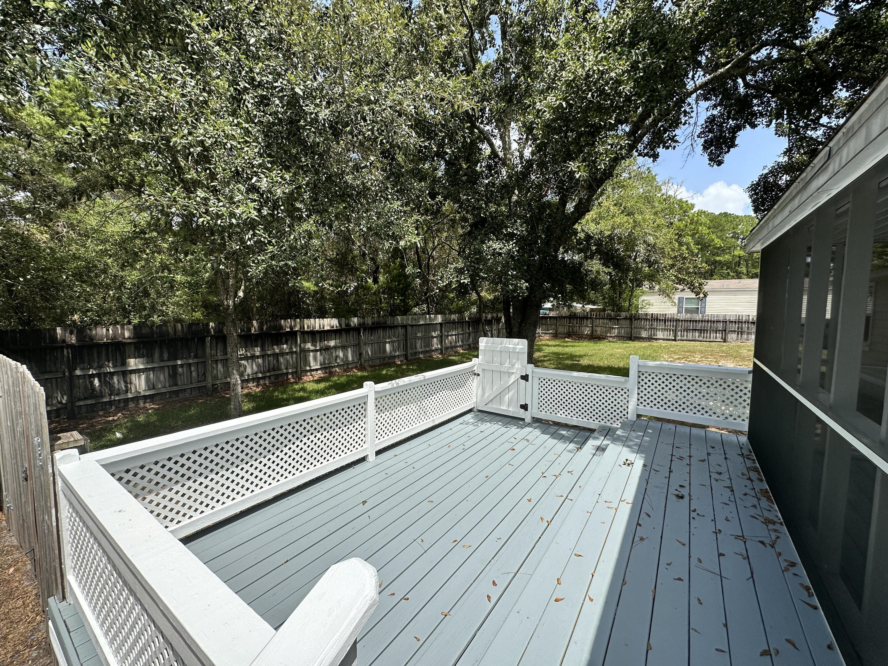 990 Chat Holley Road Santa Rosa Beach, FL 32459 - Photo 20 of 25 a view of balcony with wooden floor and lake view