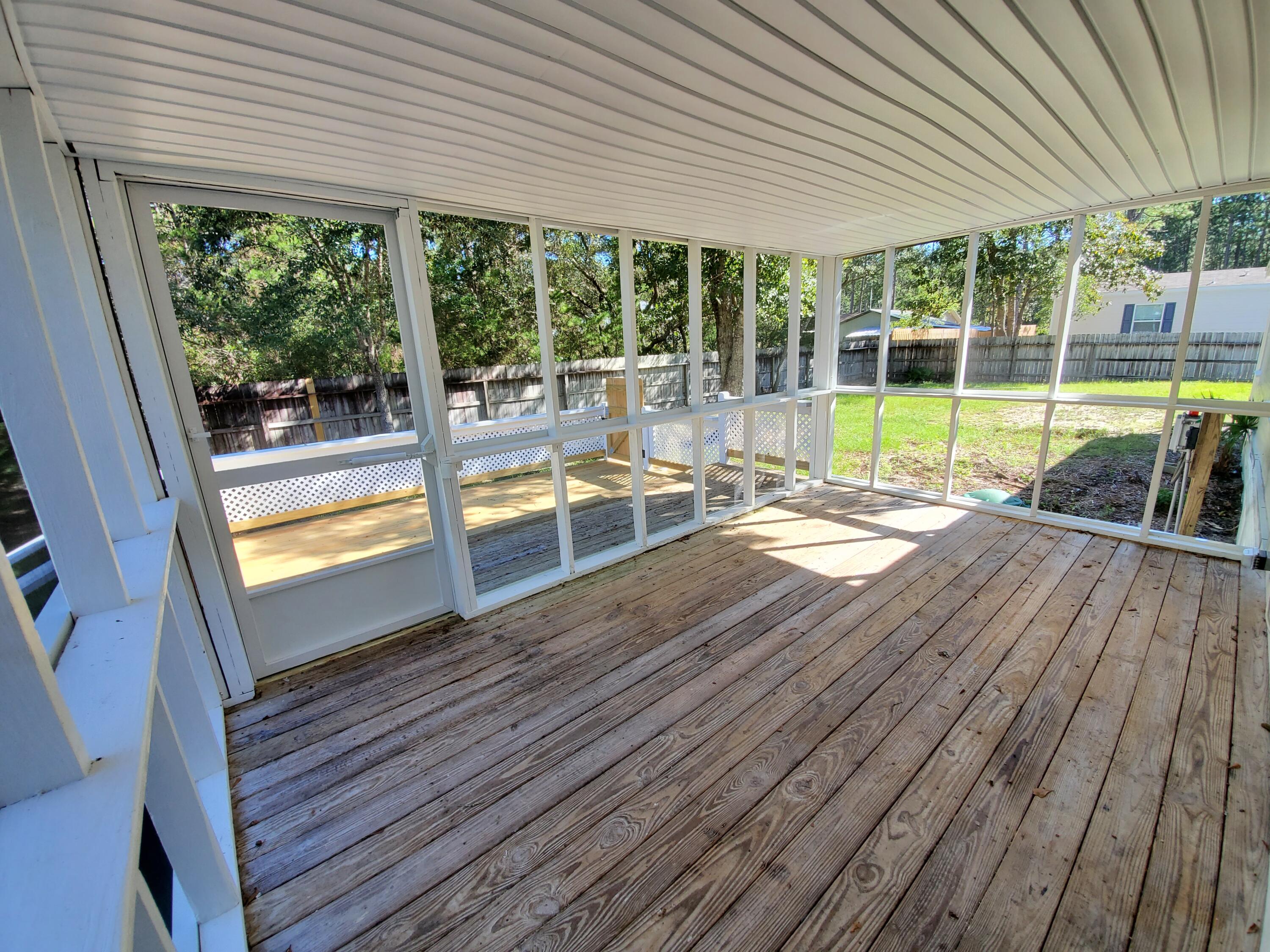 990 Chat Holley Road Santa Rosa Beach, FL 32459 - Photo 22 of 25 a view of a house with a backyard