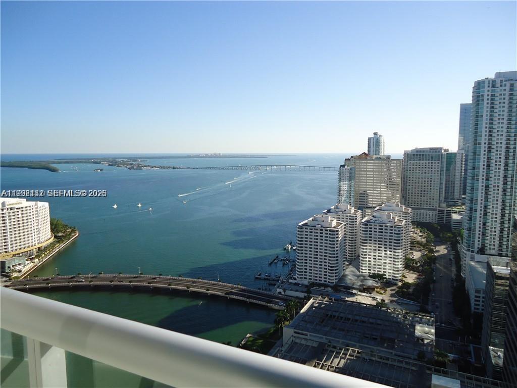 495 Brickell Avenue, Unit 3909 Miami, FL 33131 - Photo 2 of 11 a view of roof deck with two chairs and a grill
