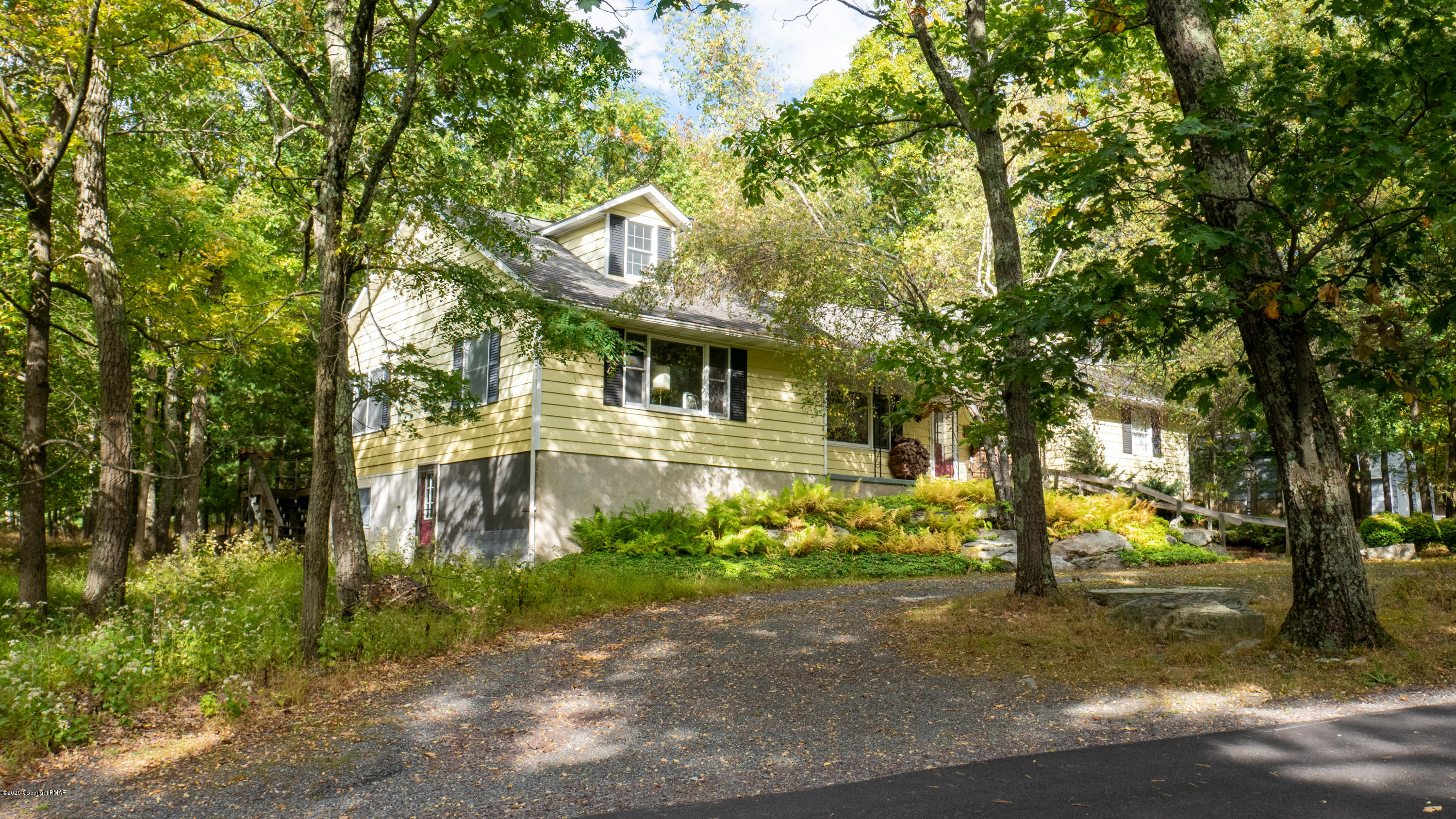104 Haverhill Road Cresco, PA 18326 - Photo 3 of 90 a front view of a house with garden
