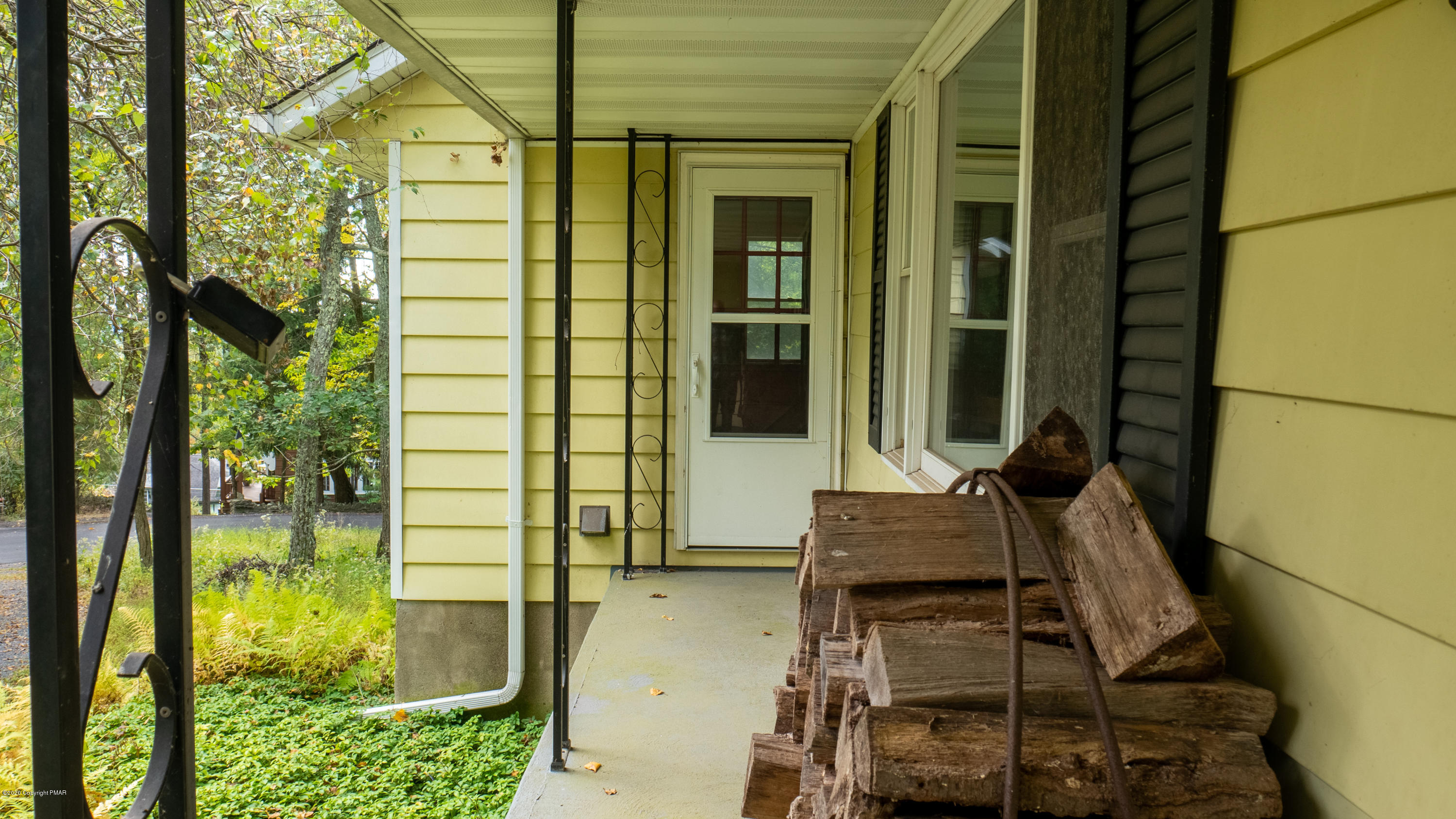 104 Haverhill Road Cresco, PA 18326 - Photo 4 of 90 a porch with a table and chairs and potted plants