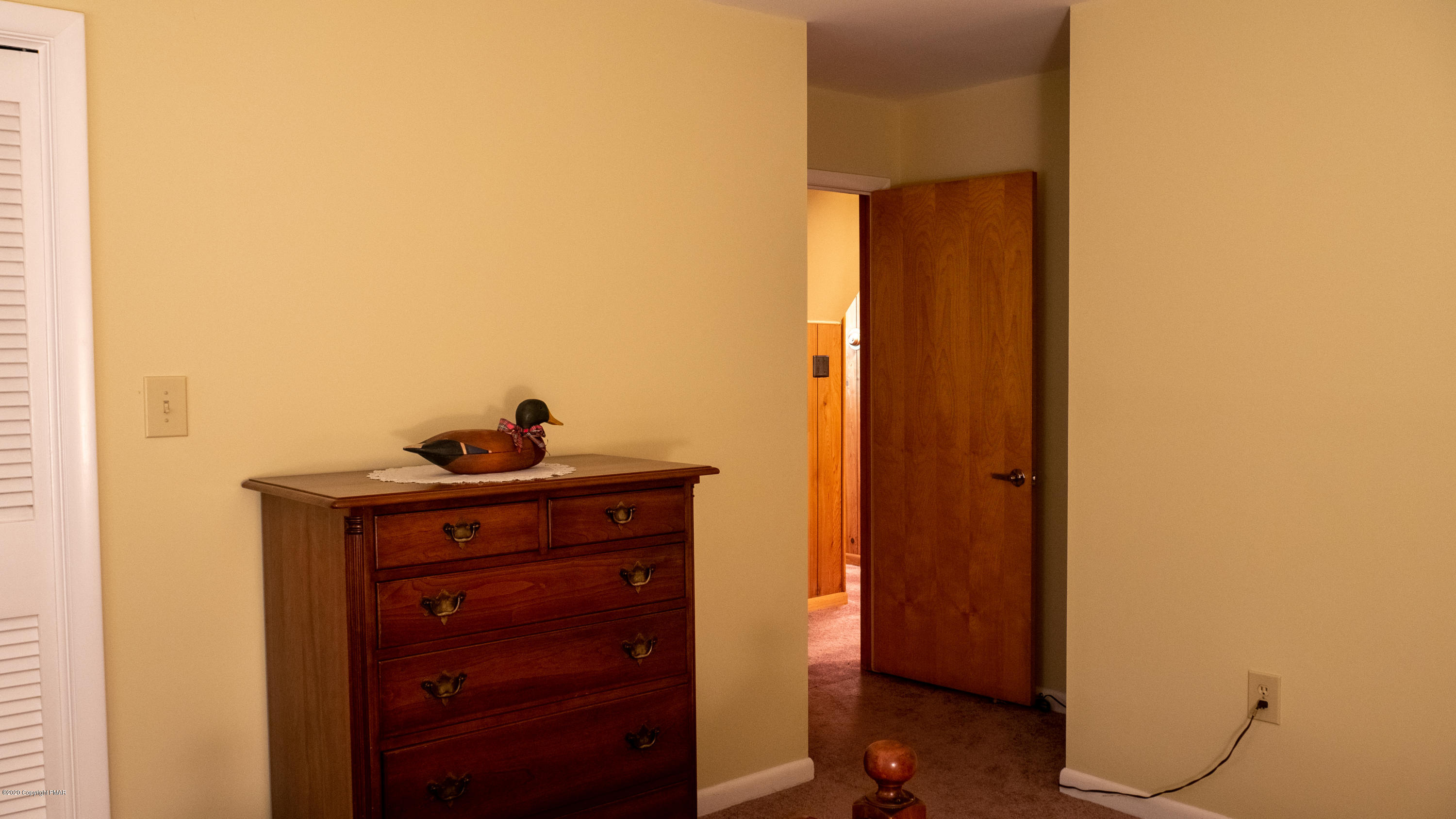 104 Haverhill Road Cresco, PA 18326 - Photo 49 of 90 a room with a mirror and a wooden floor