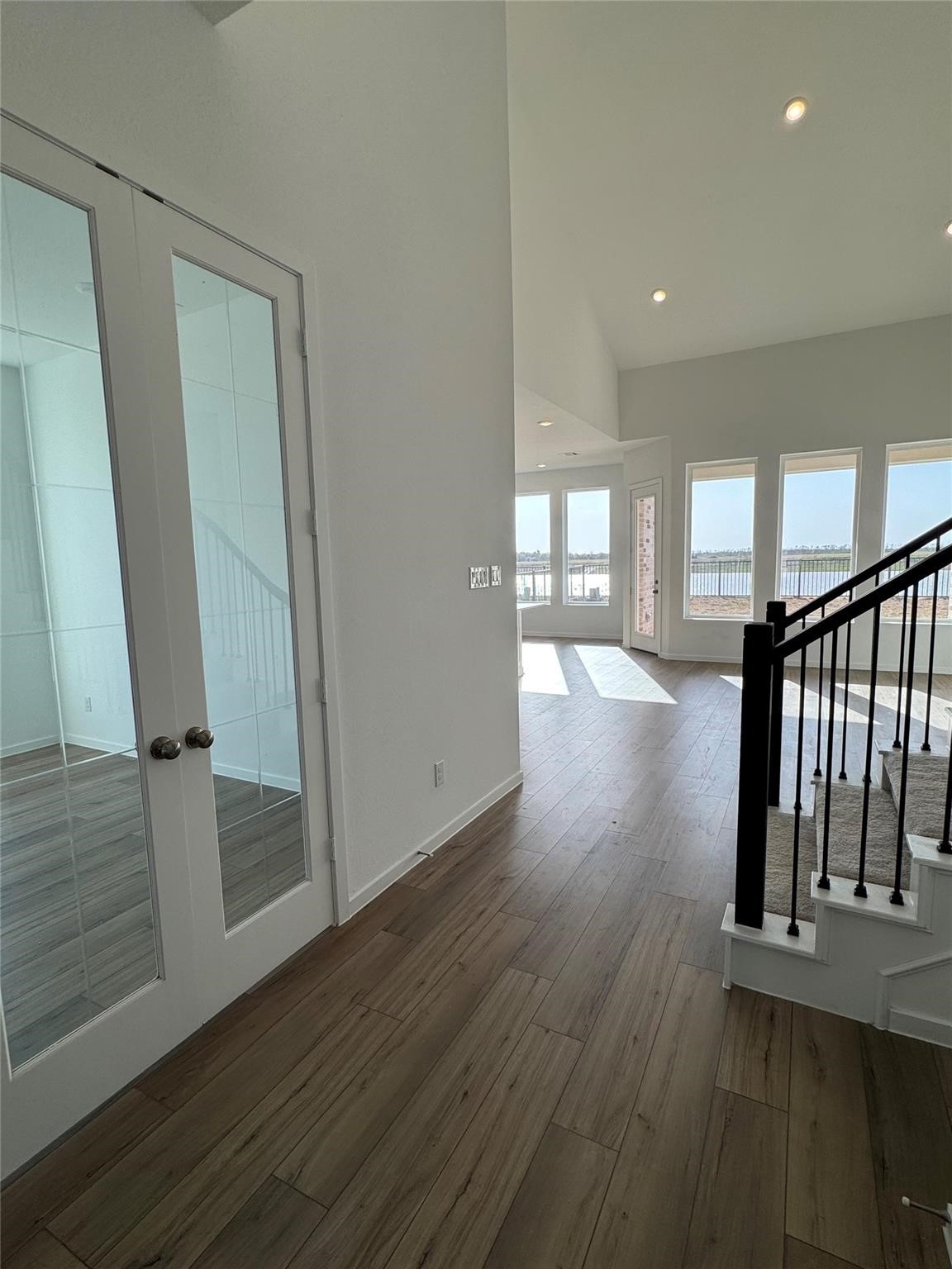 8323 Holly Blue Drive Rosharon, TX 77583 - Photo 13 of 28 a view of a hallway with wooden floor and staircase