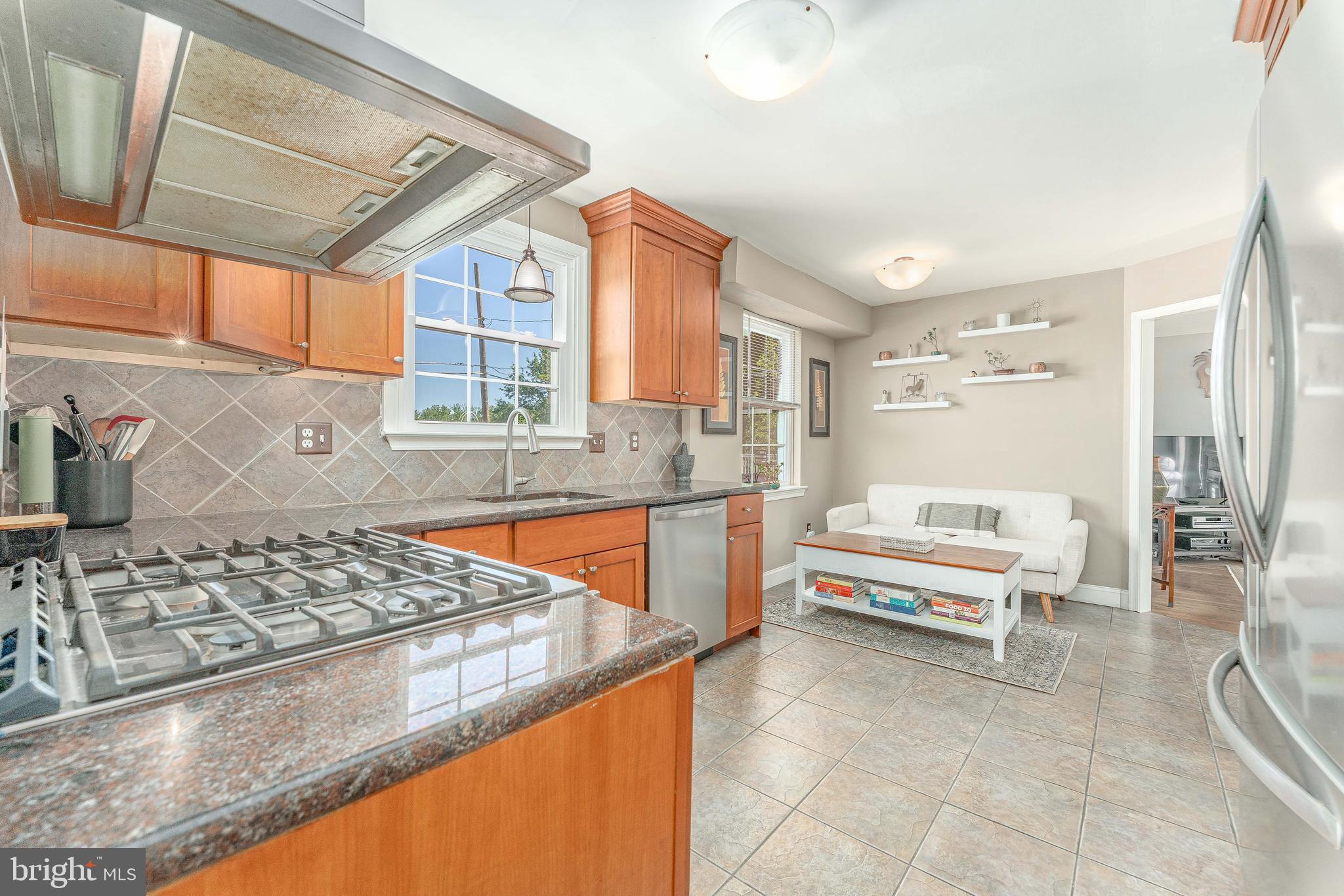 84 North Spring Lane Phoenixville, PA 19460 - Photo 16 of 51 a kitchen with stainless steel appliances kitchen island granite countertop a sink and cabinets