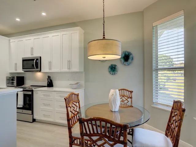 a view of a dining room with furniture wooden floor and a window