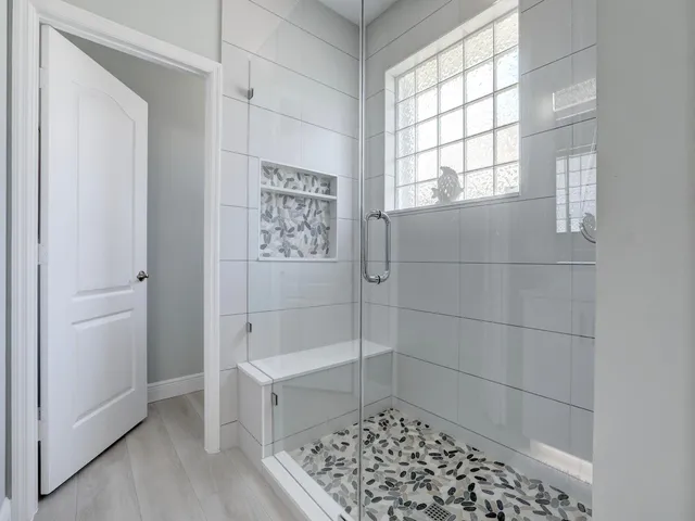 a bed room with two beds and a chandelier