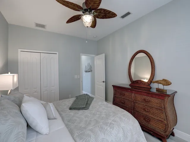 a balcony with chairs and a table