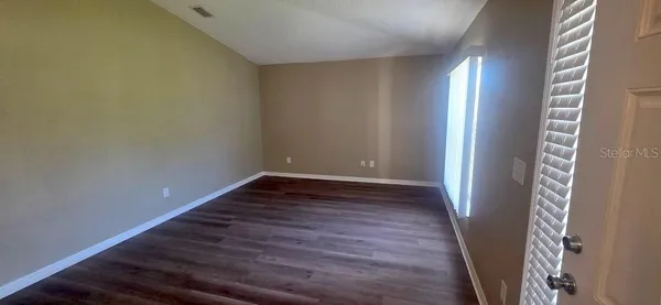 a view of entryway with wooden floor