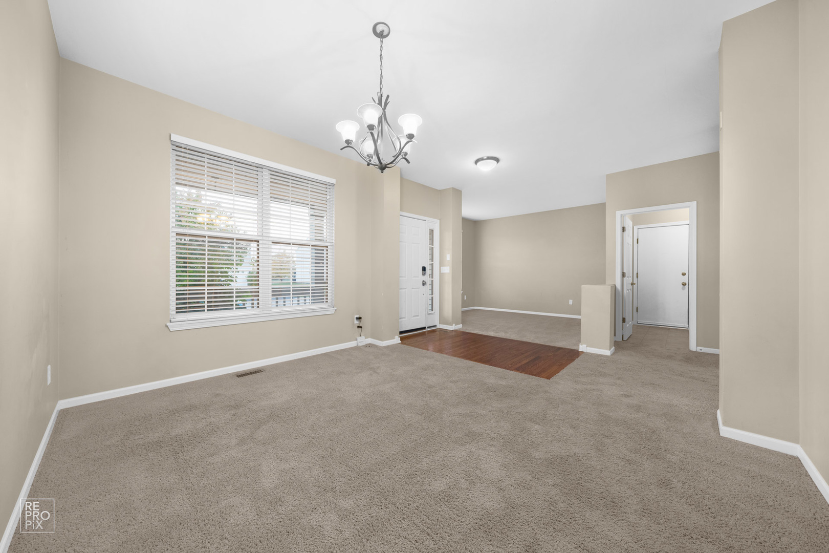2218 Surrey Street Sycamore, IL 60178 - Photo 3 of 18 a view of an empty room with a window